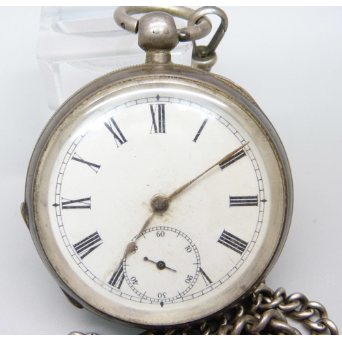 1097 - A silver Waltham pocket watch and a silver Albert chain