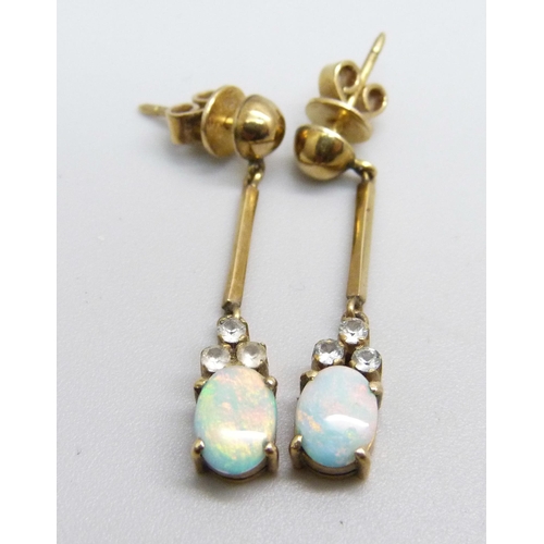 1101 - A pair of opal set pendant earrings, the butterflies marked 18k, 2.6g