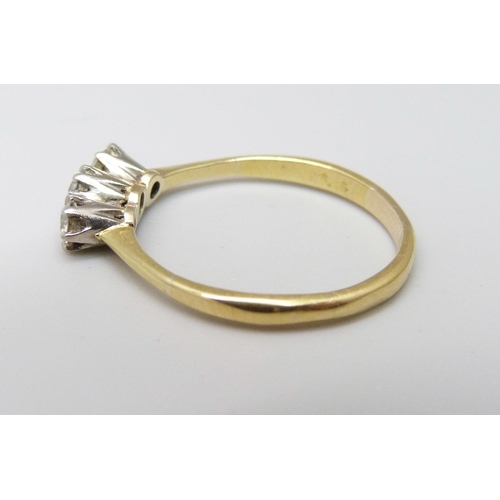 1104A - An 18ct gold and three stone diamond ring, 2.1g, N