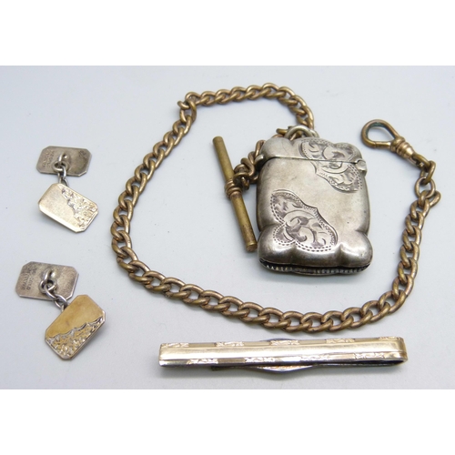 1105 - A silver vesta case, a pair of 9ct gold on silver cufflinks and a 9ct gold on silver tie-pin