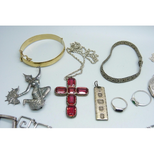 1106 - A collection of silver jewellery, etc., including a Victorian silver anchor brooch, large silver loc... 