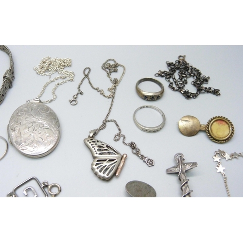 1106 - A collection of silver jewellery, etc., including a Victorian silver anchor brooch, large silver loc... 