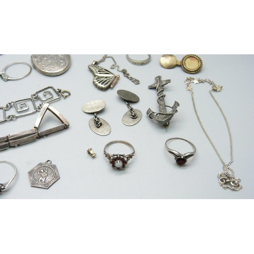 1106 - A collection of silver jewellery, etc., including a Victorian silver anchor brooch, large silver loc... 