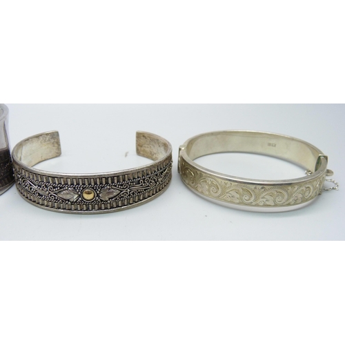 1107 - Four silver bangles including one Tiffany, 135g