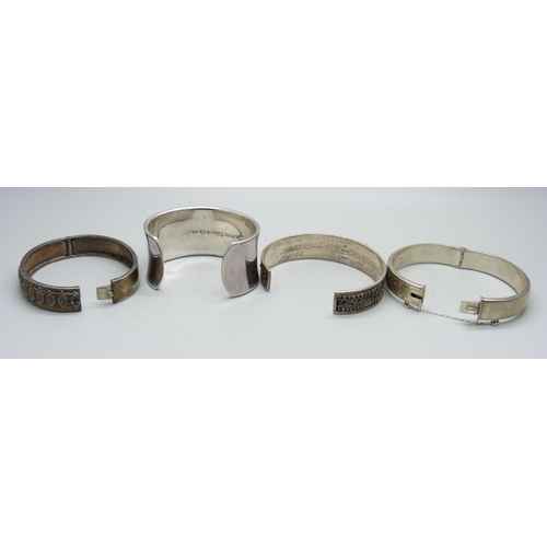 1107 - Four silver bangles including one Tiffany, 135g