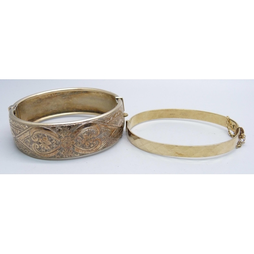 1112 - A silver gilt bangle and a 9ct gold metal core bangle