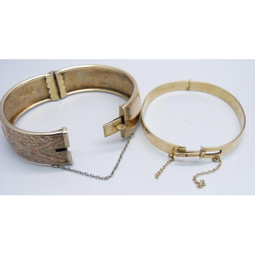 1112 - A silver gilt bangle and a 9ct gold metal core bangle