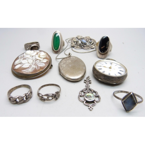 1116 - A silver locket and chain, six silver rings, etc., and a 935 silver fob watch