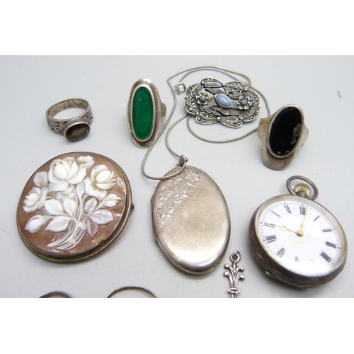 1116 - A silver locket and chain, six silver rings, etc., and a 935 silver fob watch