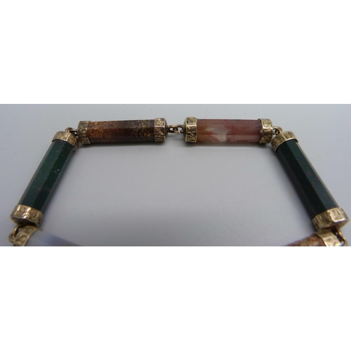 1132 - A Scottish yellow metal bracelet set with agate, bloodstone and quartz, tests as 9ct gold