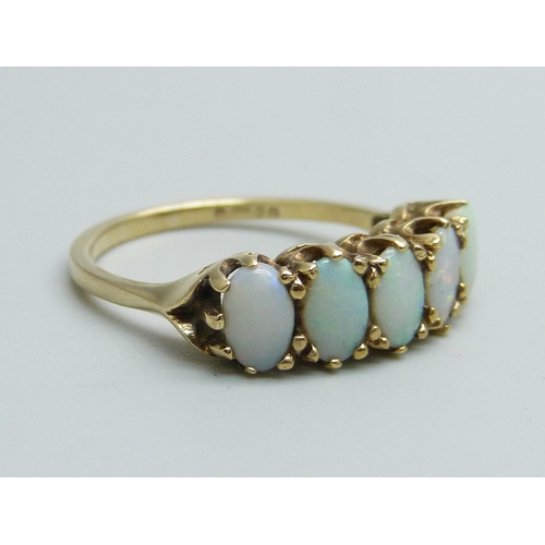 1145 - A 9ct gold and five stone opal ring, 2.7g, O