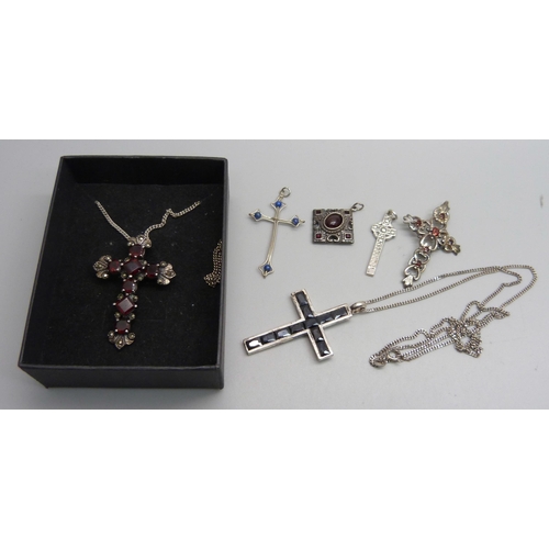 1153 - Three stone set silver cross pendants, two smaller white metal cross pendants, a square 925 silver a... 