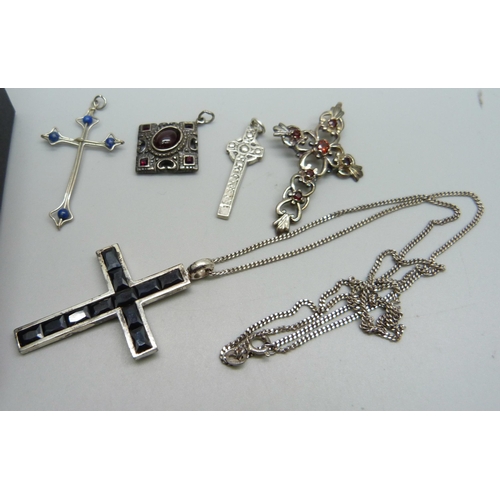 1153 - Three stone set silver cross pendants, two smaller white metal cross pendants, a square 925 silver a... 