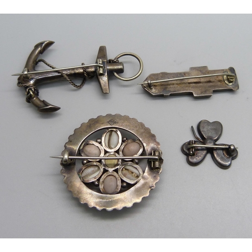 1154 - Two silver stone set brooches, a stone set anchor brooch and a Victorian 'Souvenir from John O'Groat... 