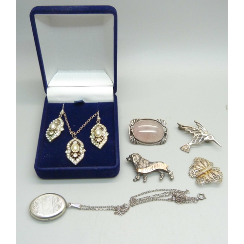 1162 - A pair of silver and diamante earrings and pendant, a silver locket and chain and four brooches