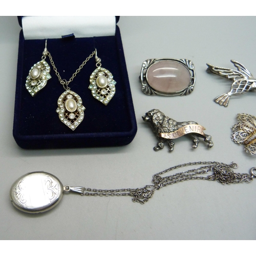 1162 - A pair of silver and diamante earrings and pendant, a silver locket and chain and four brooches