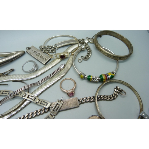 1164 - A large collection of silver jewellery, chains, rings, charm bracelet, bangles, charms, Pandora bang... 