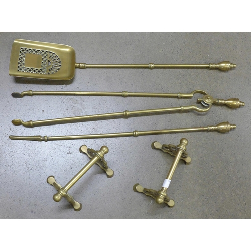 1171 - Brass fire irons and a pair of fire dogs