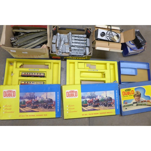 1202 - Model rail, track, two power units, carriages, a box with two carriages, two empty boxes, a collecti... 