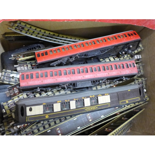 1202 - Model rail, track, two power units, carriages, a box with two carriages, two empty boxes, a collecti... 