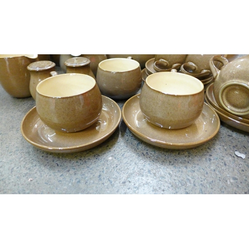 1213 - Denby Pampas pottery; a teapot, seven cups, six saucers, salt and peper pots, 7