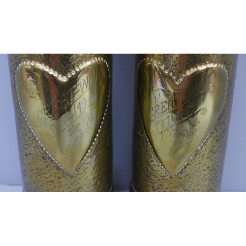 606 - A pair of brass trench art shell vases, both marked 'Great War 1914/19', 23cm