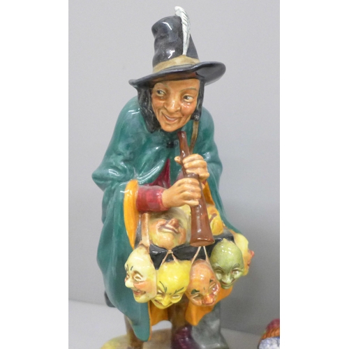 608 - Three Royal Doulton figures, The Mask Seller, Town Crier and The Old Balloon Seller