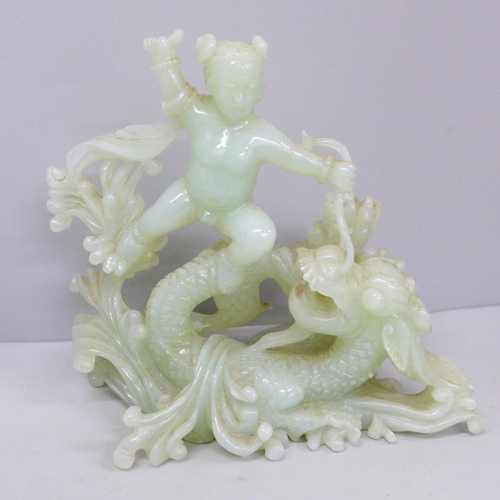 616 - A carved jade relief of Boy with Dragon, 15.5cm tall and a carved jade incense burner with hoop hand... 