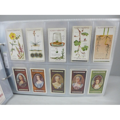 642 - Cigarette Cards; an album of Players cigarette cards, twelve complete sets including Kings and Queen... 