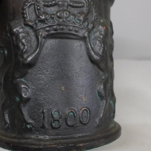 666 - A cast iron tobacco jar, a Punch and Judy nutcracker and two pieces of trench art