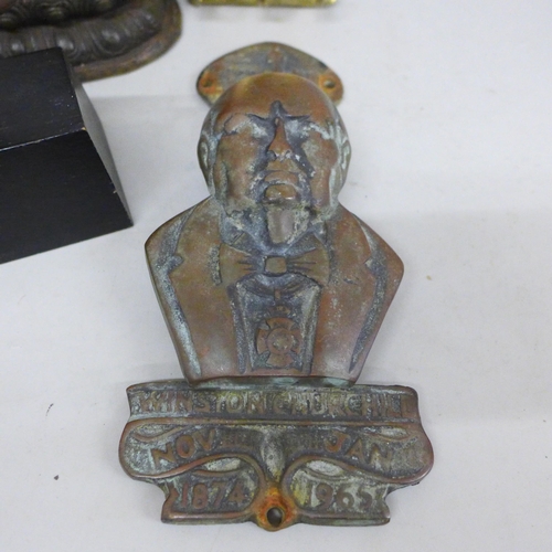 672 - A Winston Churchill brass door knocker, a brass duck shaped hook, a model of a bronze Far Eastern se... 