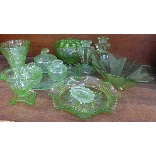 675 - A collection of uranium glass including a flower frog, dressing table set, vases, etc. **PLEASE NOTE... 