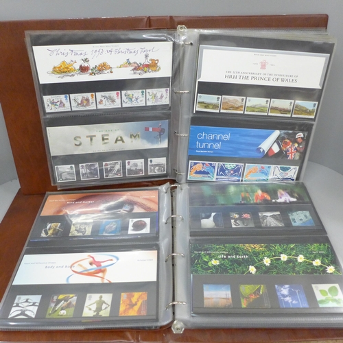 685 - Great Britain; 1993-2004 commemorative presentation packs in two special Post Office albums, 105+ pa... 