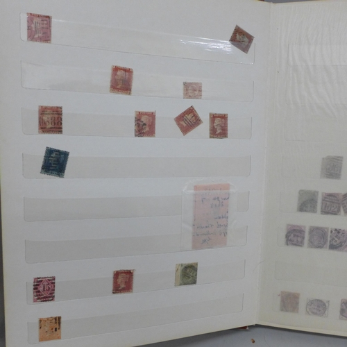 693 - An album of stamps, eight penny reds, other Victorian and later British stamps