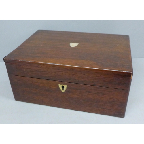 703 - A wooden sewing box with mother of pearl inlay