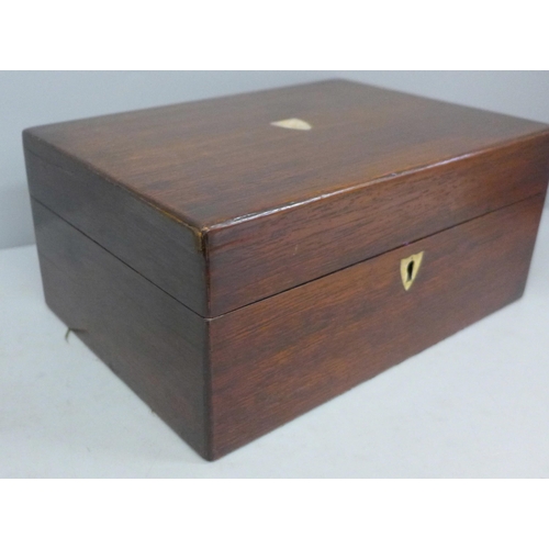 703 - A wooden sewing box with mother of pearl inlay