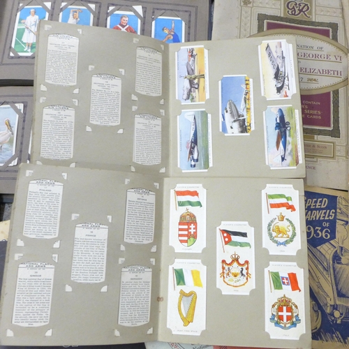 705 - A large collection of John Players and other cigarette cards, two albums of British Naval Craft and ... 