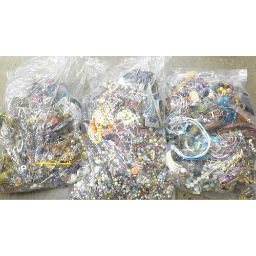 707 - Three large bags of costume jewellery