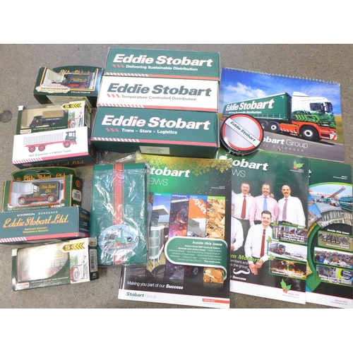 721 - A collection of Eddie Stobart items, boxed lorries, calendar, etc.