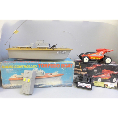 735 - A radio controlled torpedo boat and a radio controlled Mini Magnum by Nikko, both boxed