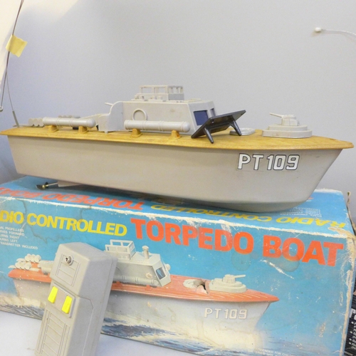 735 - A radio controlled torpedo boat and a radio controlled Mini Magnum by Nikko, both boxed