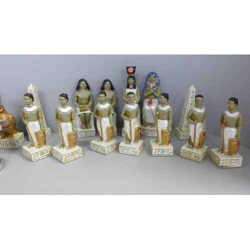 770 - A set of Egyptian and Roman chess pieces, one Egyptian pawn missing