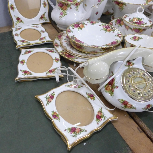 776 - A large quantity of Royal Albert Old Country Roses china including a telephone, clock, trinket boxes... 