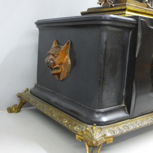 786 - A 19th Century French belge-noir mantel clock on a cast metal frame with patinated bronze sculpture ... 