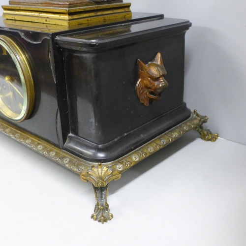 786 - A 19th Century French belge-noir mantel clock on a cast metal frame with patinated bronze sculpture ... 