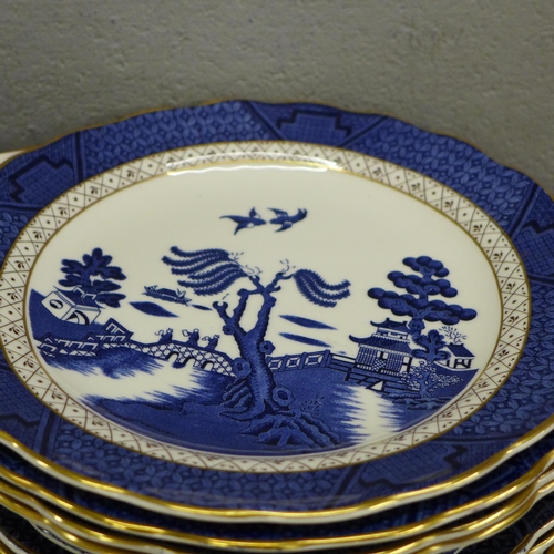 796 - Thirteen Real Old Willow plates marked A8025 Booths; a serving plate, six cups and saucers, a milk j... 