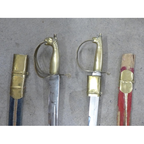 798 - A set of mounted antlers and two Indian swords