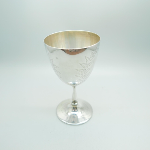 823 - A Victorian silver goblet, London 1879, with later inscription dated 1900, 133g, 13.5cm, a/f