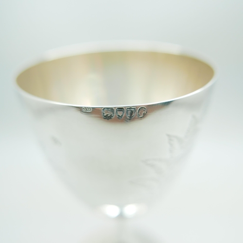 823 - A Victorian silver goblet, London 1879, with later inscription dated 1900, 133g, 13.5cm, a/f