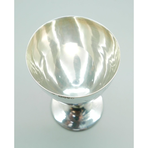 823 - A Victorian silver goblet, London 1879, with later inscription dated 1900, 133g, 13.5cm, a/f